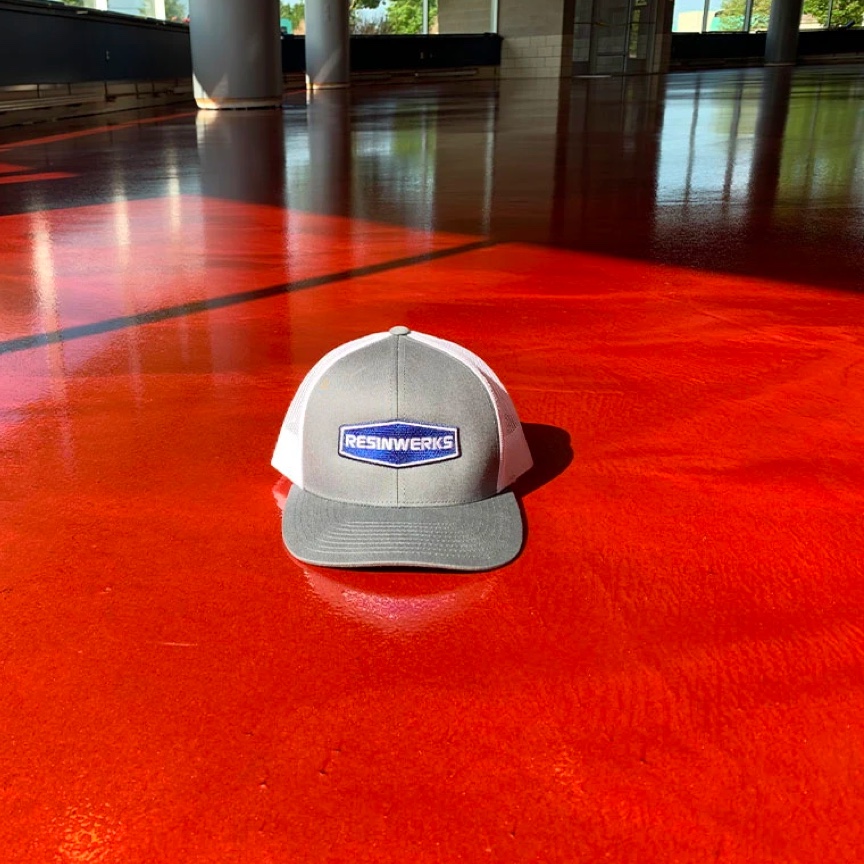 Resinwerks Hat on Large Red Metallic Epoxy Floor
